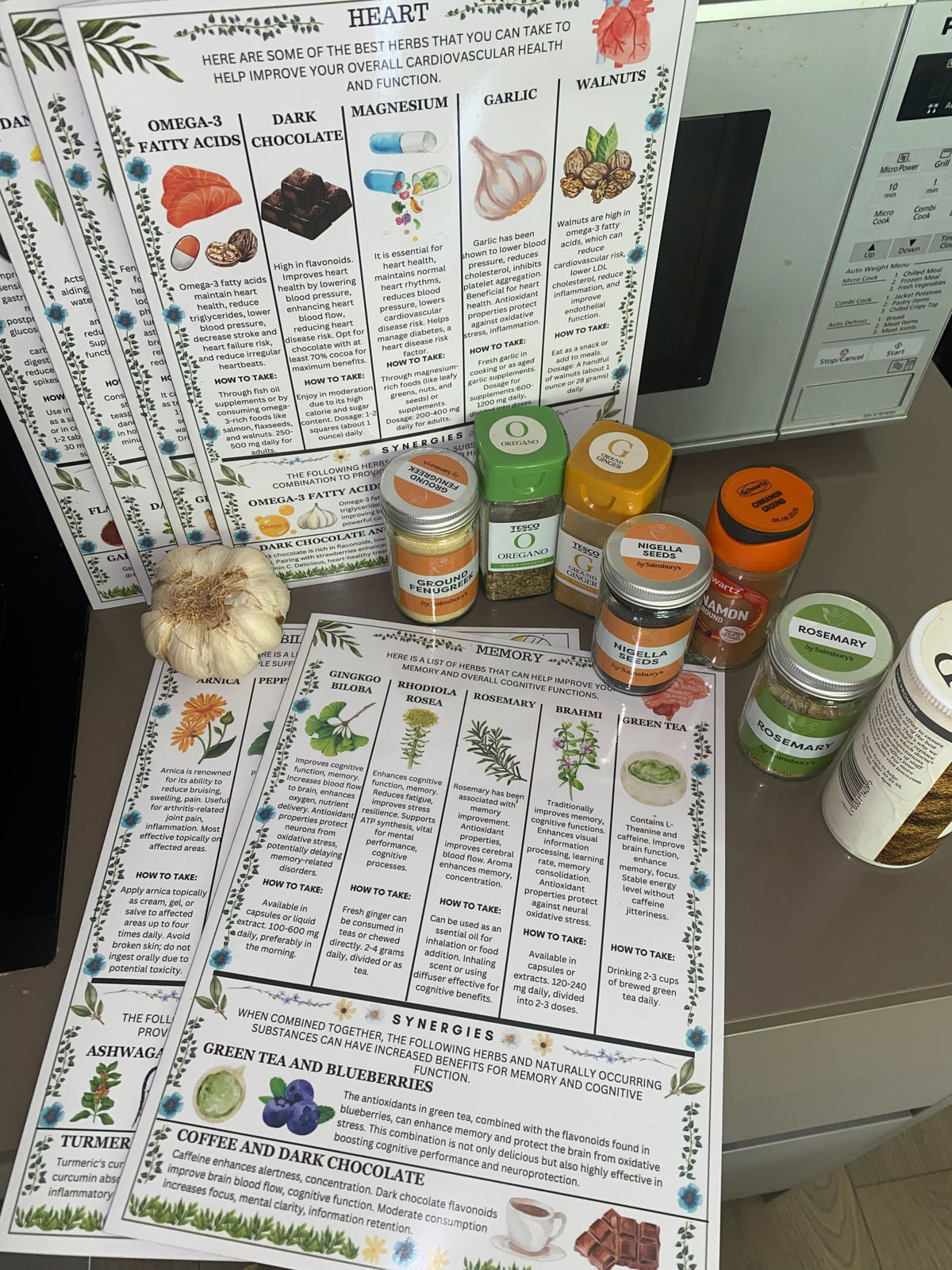 Health benefits posters and spice jars on a kitchen counter.