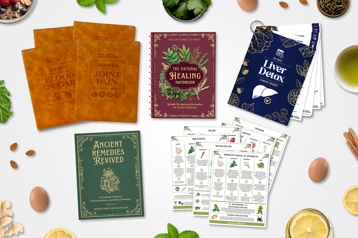 Collection of health and wellness books and guides with herbs and food items.
